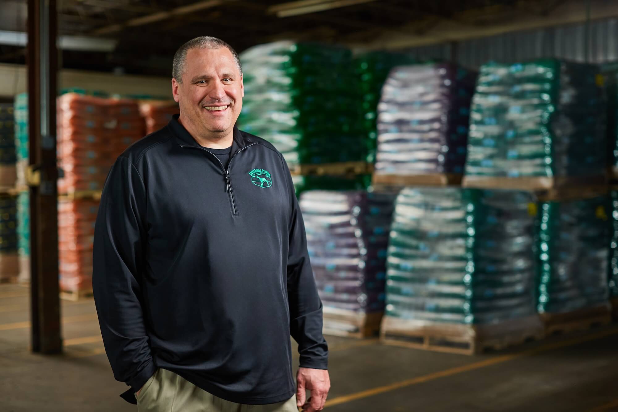 Man standing in front of products